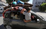 Hình ảnh người Palestine rời bỏ nhà cửa sau lệnh của Israel 