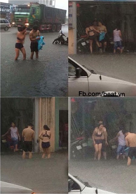 Cô gái diện bikini lội nước mưa giữa phố