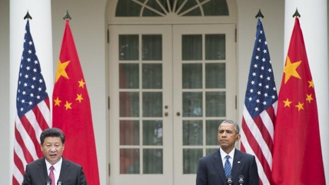 Chủ tịch Tập Cận Bình và Tổng thống Obama phát biểu tại cuộc họp báo ở Vườn hồng, Nhà Trắng, ngày 25/9. Ảnh: AFP
