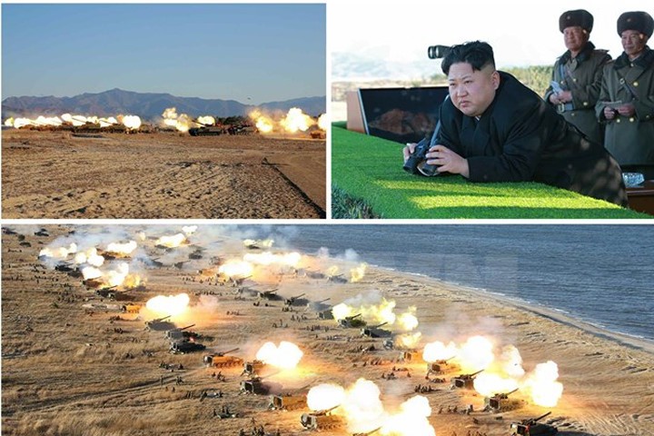 Nhà lãnh đạo Triều Tiên Kim Jong-ul (ảnh trên, góc phải) đã thị sát và chỉ đạo một cuộc tập trận pháo binh. (Nguồn: Yonhap/TTXVN)

