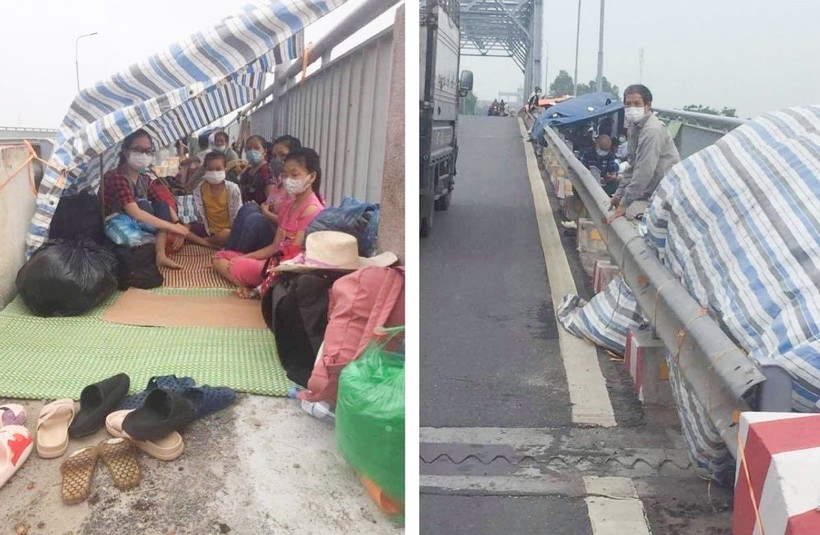 Những người dân từ Hà Nội về nhưng không được vào tỉnh Thái Bình theo quy định che bạt, trú ngụ ngay tại lan đường dành cho xe thô sơ tại khu vực cầu Triều Dương.