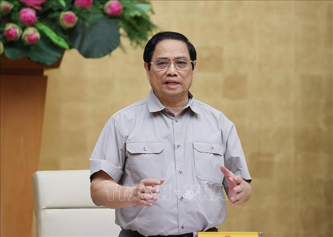 Thủ tướng Phạm Minh Chính, Trưởng Ban Chỉ đạo Quốc gia phòng, chống dịch COVID-19 chủ trì cuộc họp. Ảnh: Dương Giang/TTXVN.