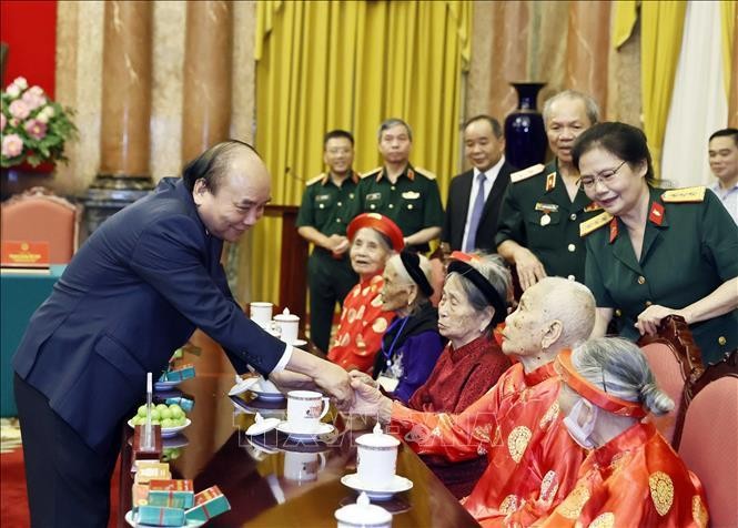 Chủ tịch nước Nguyễn Xuân Phúc với các đại biểu. Ảnh: Thống Nhất/TTXVN
