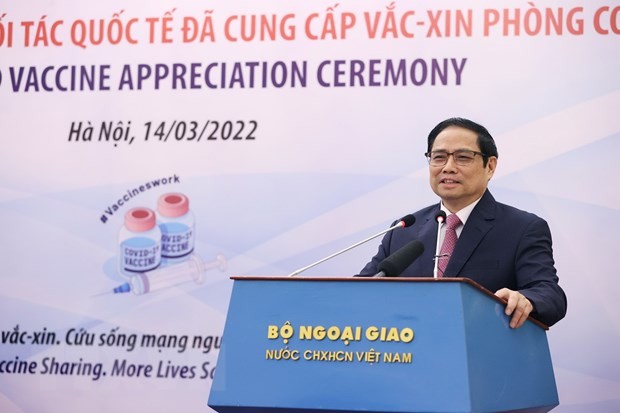 Thủ tướng Phạm Minh Chính cảm ơn các đối tác quốc tế đã hỗ trợ vaccine phòng COVID-19 cho Việt Nam. (Ảnh: Dương Giang/TTXVN).