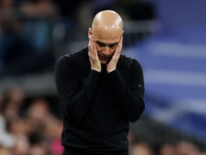 HLV Guardiola bất ngờ trách móc học trò sau trận thua Real. Ảnh: Reuters.
