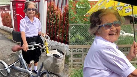 Cụ bà 84 tuổi mặc đồng phục, đạp xe về nhà sau kỳ thi hết lớp 6
