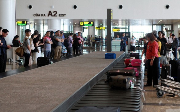 Băng chuyền trả hành lý tại nhà ga hành khách T2, Cảng hàng không quốc tế Nội Bài - Ảnh: Tuấn Phùng

