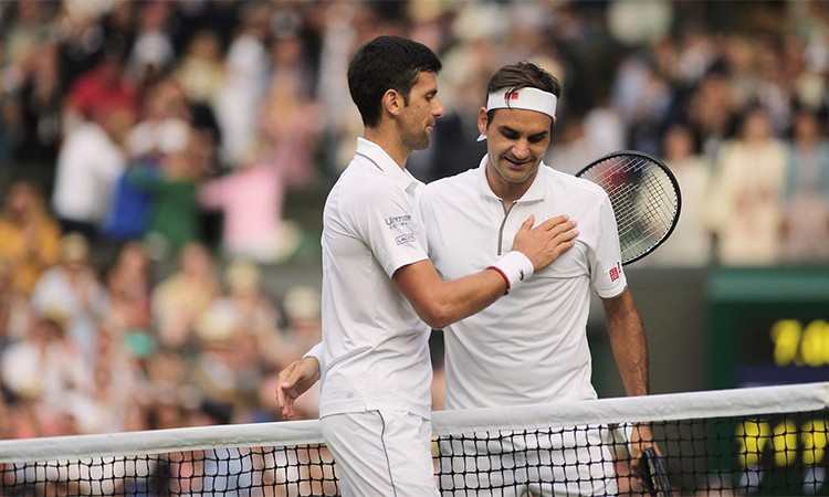 Federer (phải) lỡ cơ hội đoạt Grand Slam thứ 21